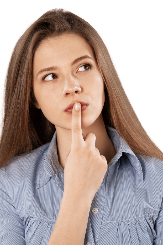Woman thinking with her finger on her lips